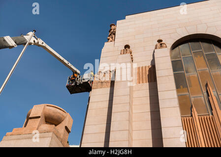 September 2016: A photographer takes shots in preparation for the restoration of statues on the ANZAC Memorial in Hyde Park, Sydney, Australia Stock Photo