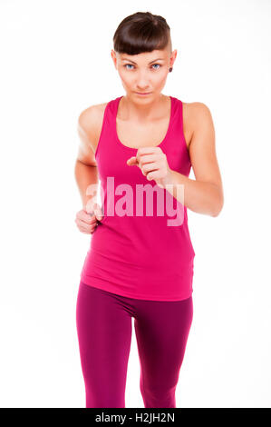 Woman in fitness outfit running, isolated over white background. Stock Photo