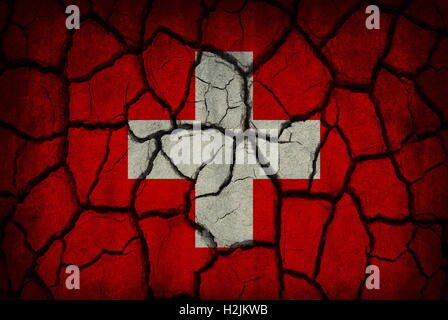 Switzerland flag painted on cracked soil Stock Photo