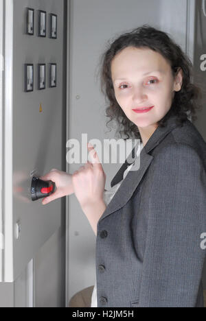 Woman working on telecommunication equipment Stock Photo