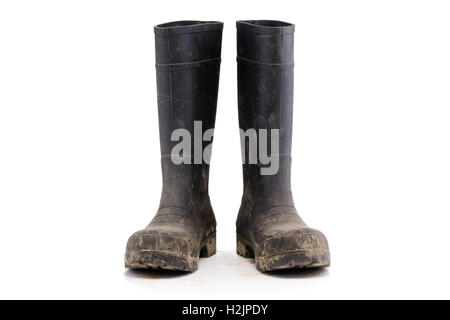 Dry dirty Mud boots isolated on white background front view Stock Photo