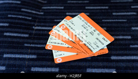 Pair of train tickets for a journey from Witham to Clacton in Essex England on a fabric background Stock Photo