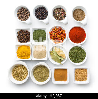 Various dried herbs and spices isolated on white background. Stock Photo