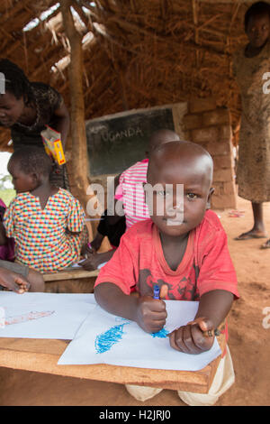 Students practice art and drawing at a primary school in Kaberamaido, Uganda. Stock Photo