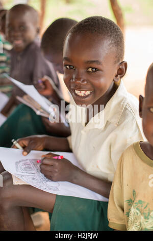 Students practice art and drawing at a primary school in Kaberamaido, Uganda. Stock Photo