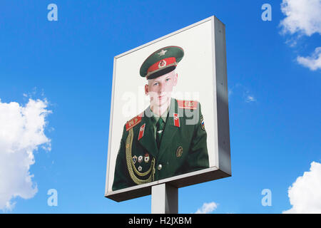 Photograph of soldier placed on sign at Checkpoint Charlie (or 'Checkpoint C') given name by the Western Allies to the best-know Stock Photo