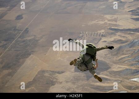 U.S. Army special operation soldiers free fall during a HALO parachute training jump February 22, 2012 near Fairfield, Utah. Stock Photo