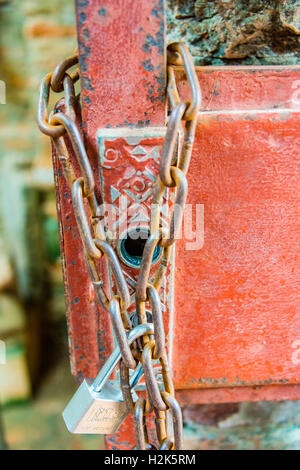 Padlock with iron chain hanging on a door, detail, Mỹ Sơn, My Son, Central Vietnam, Quang Nam, Vietnam Stock Photo