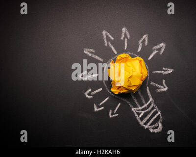 Crumpled paper with a hand drawn light bulb, many ideas concept Stock Photo