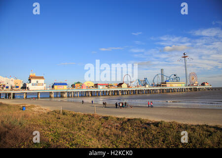 Historic Pleasure Pier amusement park and beach on the Gulf of Mexico coast in Galveston, Texas Stock Photo