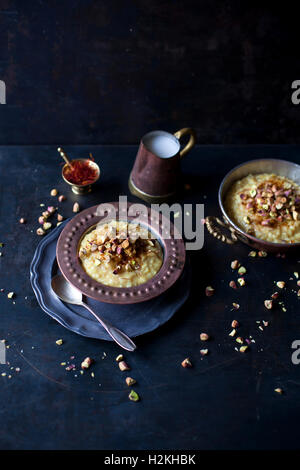 Saffron and pistachios rice pudding Stock Photo