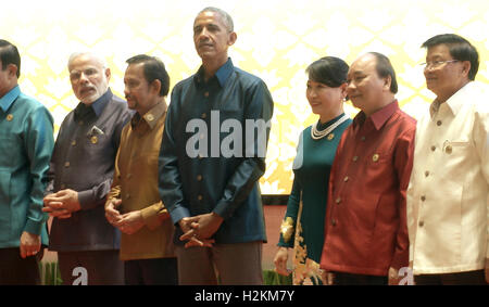 U.S. President Barack Obama takes part in a group photo at the Association of Southeast Asian Nations (ASEAN) summit, Obama attempted to exorcise some of these ghosts. “Given our history here, I believe that the United States has a moral obligation to help Laos heal,” Obama told an audience in the Laotian capital Vientiane, committing an additional $90 million over the three years toward removing unexploded ordnance. Stock Photo