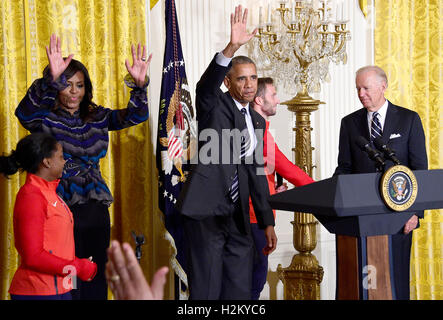 United States President Barack Obama and first lady Michelle Obama welcome the 2016 US Olympic and Paralympic teams to the East Room of the White House in Washington, DC to honor their participation and success in this year’s Games in Rio de Janeiro, Brazil.  From left to right: Simone Biles, first lady Michelle Obama, President Obama, US Army Staff Sergeant Josh Brunais, and US Vice President Joe Biden. Credit: Ron Sachs / Pool via CNP /MediaPunch Stock Photo
