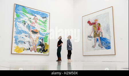Hamburg, Germany. 30th Sep, 2016. Two women look at the artworks 'B. for Larry' (l) and 'The new guy' by artist Georg Baselitz in the exhibition 'Viehof Collection - Internation Art in the Presence' during a press appointment at Deichtorhallen in Hamburg, Germany, 30 September 2016. The Viehof collection, one of the most prominant German private collections, is on display from 1 Octobre 2016 until 22 January 2017 at Deichtorhallen in Hamburg. PHOTO: DANIEL BOCKWOLDT/dpa/Alamy Live News Stock Photo