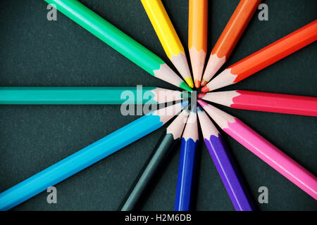 Pencils of different colors close up isolated on black Stock Photo