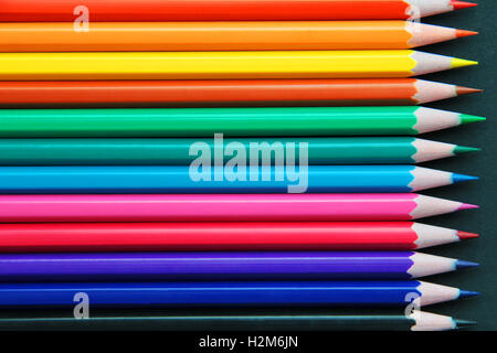 Pencils of different colors close up isolated on black Stock Photo