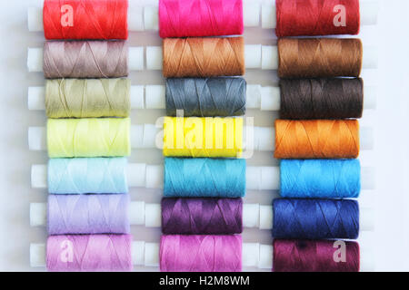 Sewing threads of different colors in beautiful pattern Stock Photo