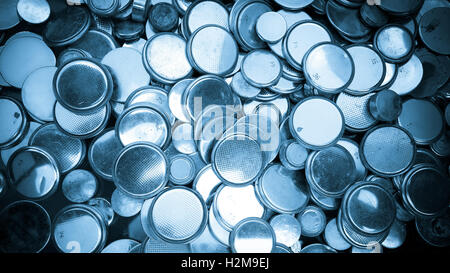 Lithium batteries of various sizes background blue toned Stock Photo