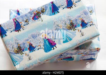 Christmas shoeboxes wrapped in Frozen wrapping paper for charity for children not so privileged Stock Photo