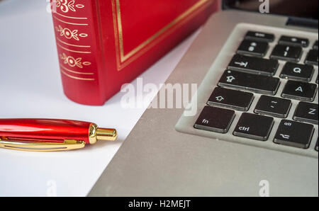 Pen,Book and the Laptop on white Stock Photo