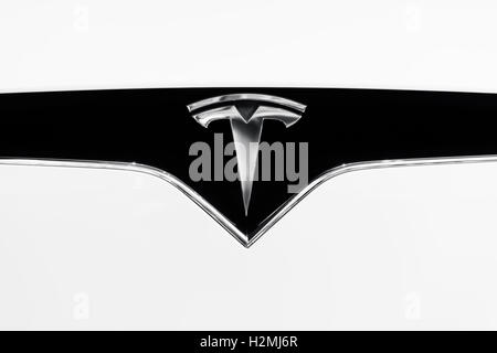 Tesla Motors electric car emblem on a hood of white 2017 Tesla X logo trademark closeup Stock Photo