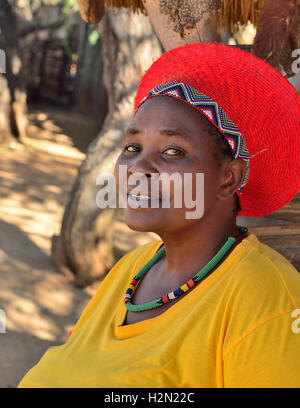 Shakaland Zulu lady troupe member poses in a traditional  Zulu hat at the Shakaland Cultural Village Stock Photo