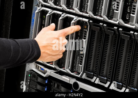 Technicians Hand Touching Blade Server At Data Center Stock Photo