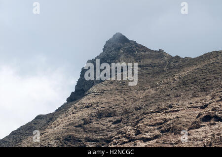 Fuerteventura, Canary Islands, North Africa: a peak of one of the mountains of the Morro del Jable mountain range on the road to the village of Cofete Stock Photo
