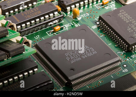 Electronic printed circuit board with components Stock Photo