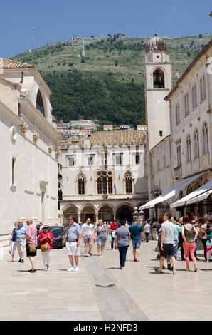 Dubrovnik Croatia  Tourists in the old town of Dubrovnik walk towards the Sponza Palace Stock Photo