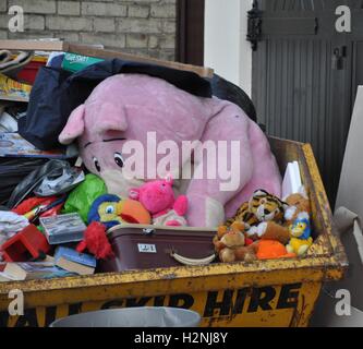Abandoned teddy bear in the trash can. The symbol of leaving childhood ...