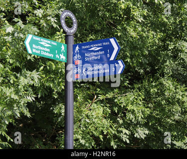 MANCHESTER, ENGLAND, AUGUST 24 2016: A sign post for the Trans Pennine Trail, a 215 miles long route for walkers and cyclists. Stock Photo