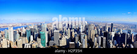 Full view of New York Cities Skyline, Midtown Manhattan Island, New York City on a clear day with a bright blue sky - USA. Stock Photo