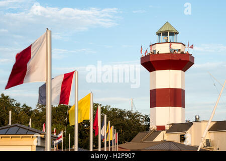 Flags Flying at Harbour Town Lighthouse in Sea Pines Resort on Hilton Head Island, South Carolina Stock Photo