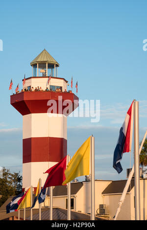 Flags Flying at Harbour Town Lighthouse in Sea Pines Resort on Hilton Head Island, South Carolina Stock Photo