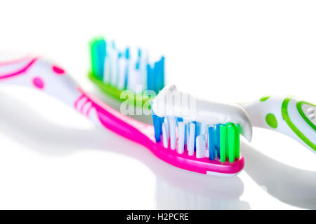 two toothbrushes closeup on against white background Stock Photo