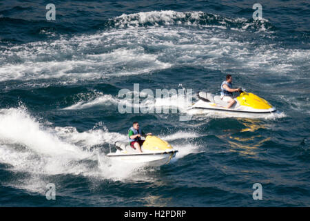 ACAPULCO, MEXICO - FEBRUARY 19, 2006: Two man driving jet skis in the bay of Acapulco, Mexico. Stock Photo
