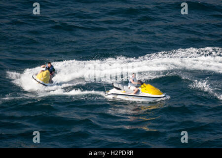 ACAPULCO, MEXICO - FEBRUARY 19, 2006: Two men riding jet skis in the bay of Acapulco, Mexico. Stock Photo