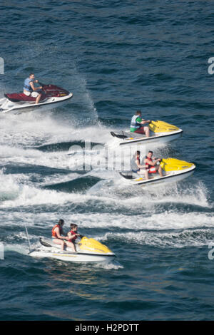 ACAPULCO, MEXICO - FEBRUARY 19, 2006 : Tourists riding on four jet skis in the bay of Acapulco, Mexico. Stock Photo