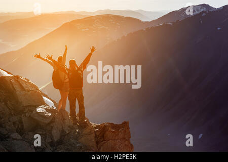 Happy couple stays on the mountains background concept Stock Photo