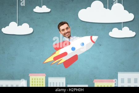 businessman flying on rocket above cartoon city Stock Photo