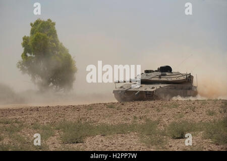 A Merkava Tank Of The Israeli Army Maneuvering Near The Border With ...