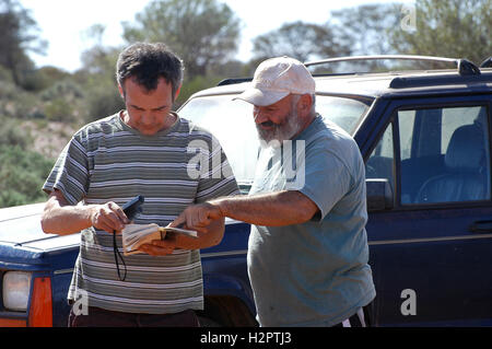 in search of the good road in the Australian bush using a gps connected to a laptop. Stock Photo