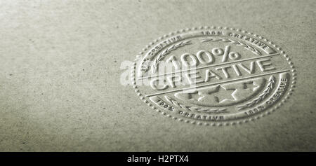 3D illustration of an embossed stamp with the text 100 percent creative. Background for communication on creativity and innovati Stock Photo