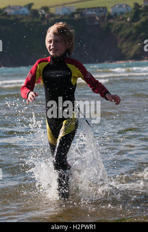 A boy splashing in the sea Stock Photo - Alamy