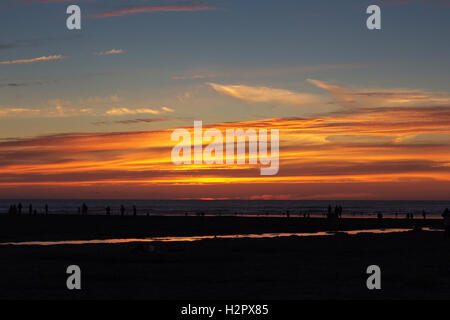 Colourful sunset over the beach at Polzeath, Cornwall Stock Photo