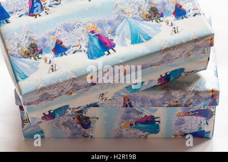 Christmas shoeboxes wrapped in Frozen wrapping paper for charity for children not so privileged Stock Photo