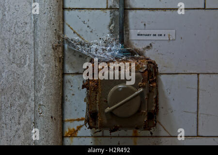 Rusty electrical switch within St Ann's Hospital Mortuary, Haringey, North London, UK Stock Photo