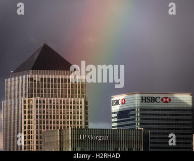 London, UK. 1st October, 2016. UK Weather: Colourful rainbow breaks after a brief afternoon rainstorm over Canary Wharf business park buildings Credit:  Guy Corbishley/Alamy Live News Stock Photo