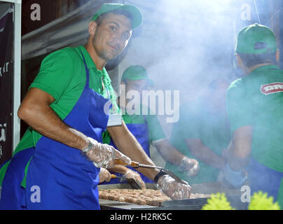 Bucharest, Romania. 01st Oct, 2016: Making mici, the traditional Romanian fast food on the grill at the first Bucharest Market held in Piata Constitutiei Credit:  Douglas MacKenzie/Alamy Live News Stock Photo